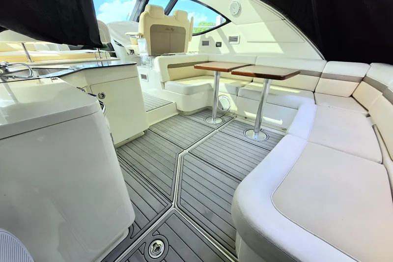 Slide: The Image of Luxurious interior of 2014 Sea Ray 470 Sundancer yacht with elegant seating and tables. - 16