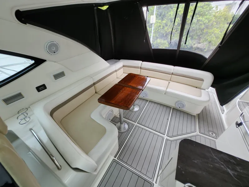 Slide: The Image of Luxurious interior of 2014 Sea Ray 470 Sundancer yacht with elegant seating and wooden table. - 20