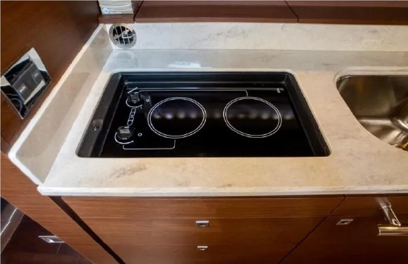 Slide: The Image of Modern kitchen area in 2014 Sea Ray 470 Sundancer yacht with stovetop and sink. - 41