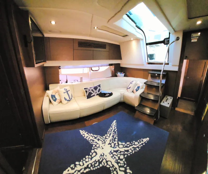Slide: The Image of Luxurious interior of 2014 Sea Ray 470 Sundancer yacht with plush seating and nautical decor. - 44