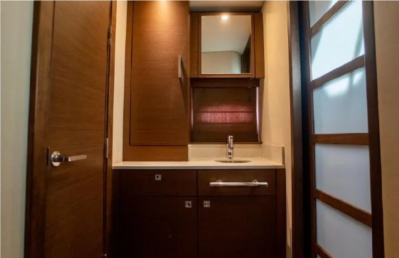 Slide: The Image of Luxurious bathroom interior of 2014 Sea Ray 470 Sundancer yacht with wooden cabinetry. - 46