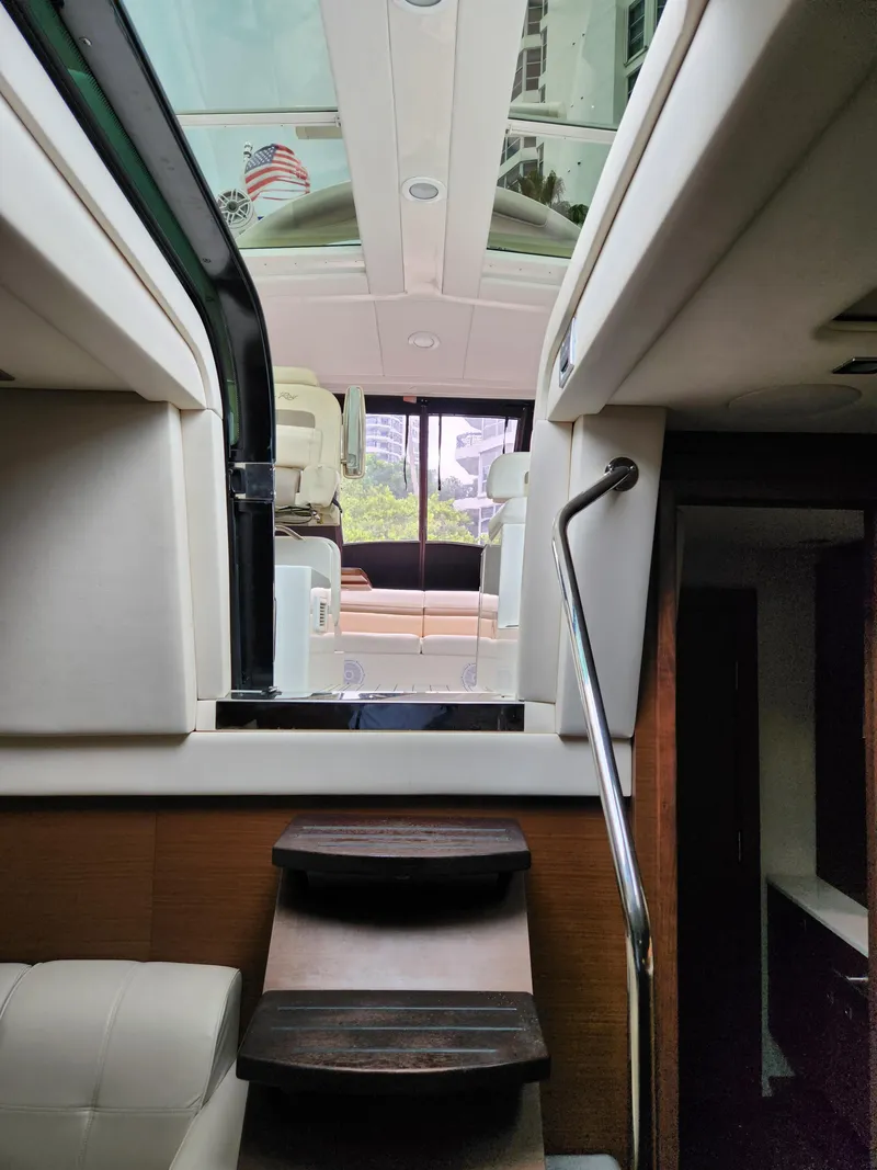 Slide: The Image of Interior view of 2014 Sea Ray 470 Sundancer yacht with stairs and seating area. - 49