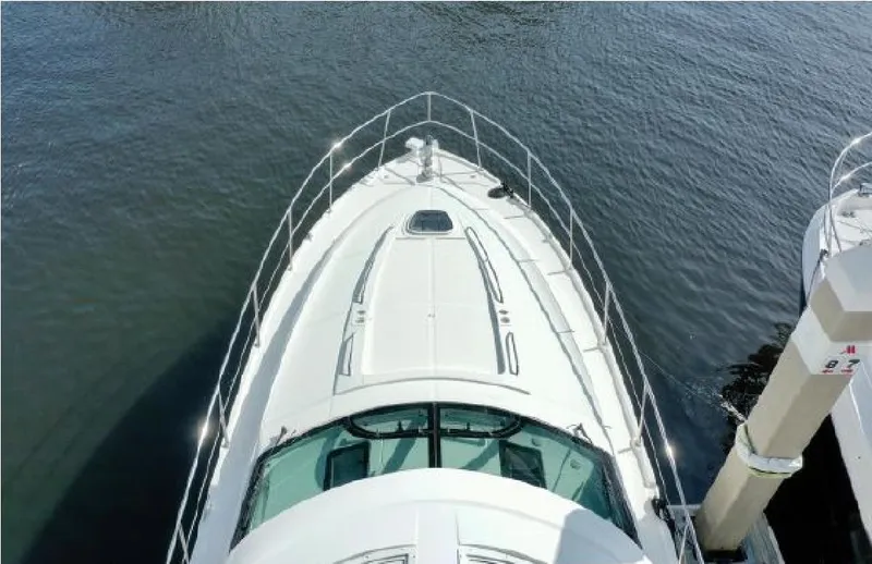 Slide: The Image of 2014 Sea Ray 470 Sundancer yacht, aerial view, docked on calm water. - 6