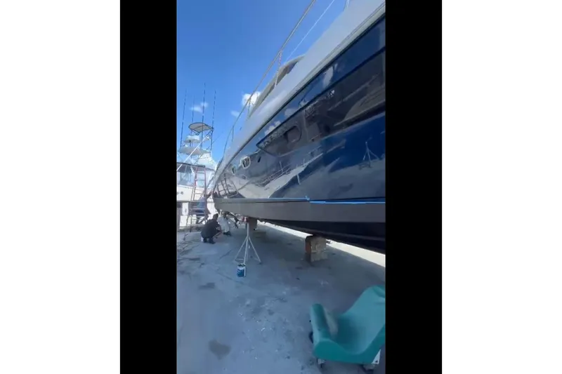 Slide: The Image of 2014 Sea Ray 470 Sundancer yacht on dry dock, undergoing maintenance. - 66