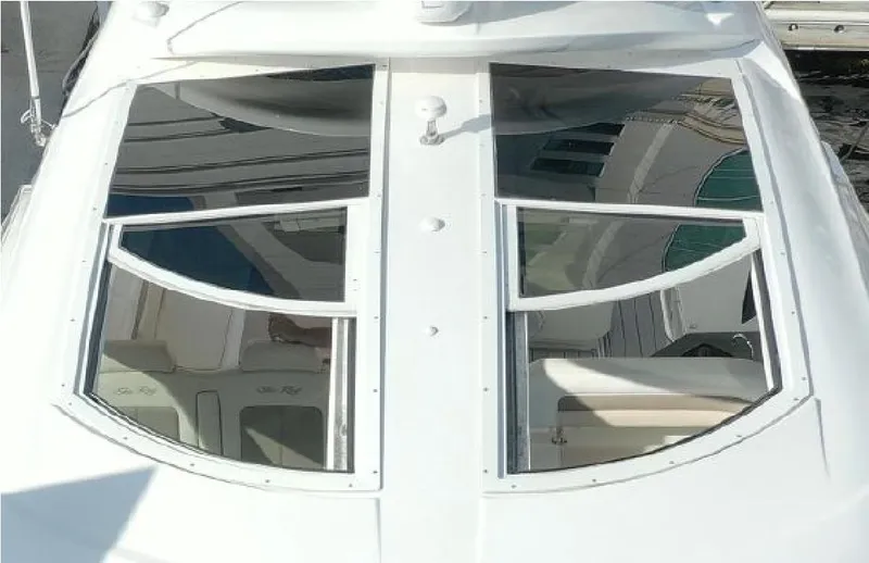 Slide: The Image of 2014 Sea Ray 470 Sundancer yacht with sleek, modern windows and luxurious design. - 7