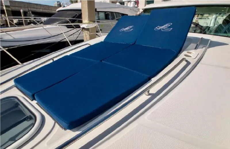 Slide: The Image of 2014 Sea Ray 470 Sundancer yacht with blue sun pads on deck. - 9