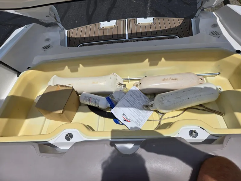 Slide: The Image of Storage compartment of a 2001 Yamaha Boats LS 2000 with boating accessories. - 21