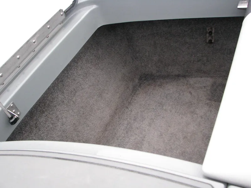 Slide: The Image of 2014 MB B-52 23 Widebody boat storage compartment, gray interior, open lid. - 11
