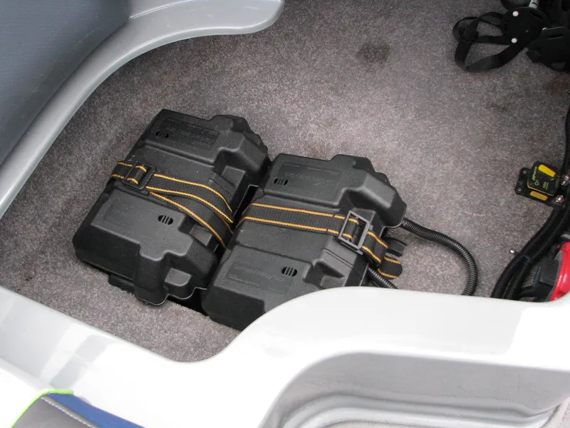 Slide: The Image of Battery compartment in 2014 MB B-52 23 Widebody boat, featuring dual black battery boxes. - 12