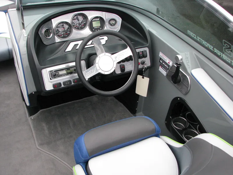 Slide: The Image of 2014 MB B-52 23 Widebody boat dashboard with steering wheel and control panel. - 5