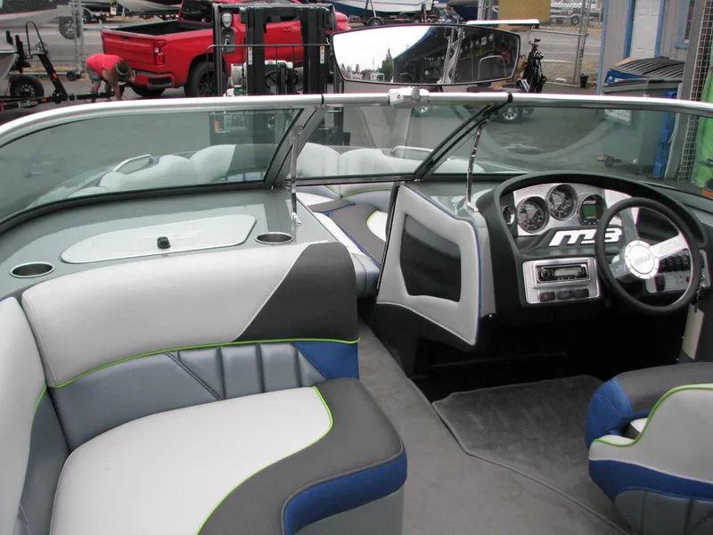 Slide: The Image of 2014 MB B-52 23 Widebody boat interior with modern dashboard and seating. - 7