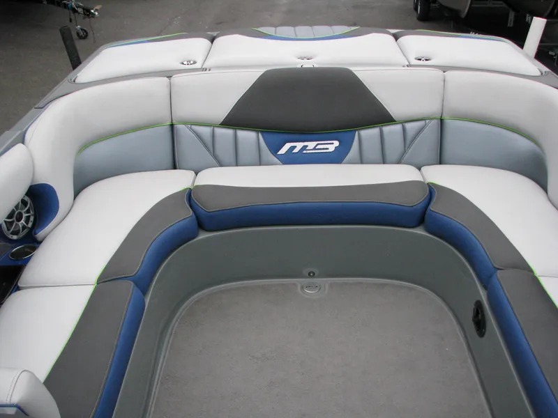 Slide: The Image of 2014 MB B-52 23 Widebody boat interior with gray and blue seating. - 8