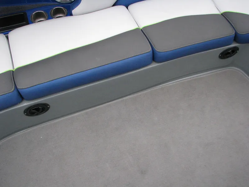 Slide: The Image of 2014 MB B-52 23 Widebody boat interior with gray, blue, and white seating. - 9