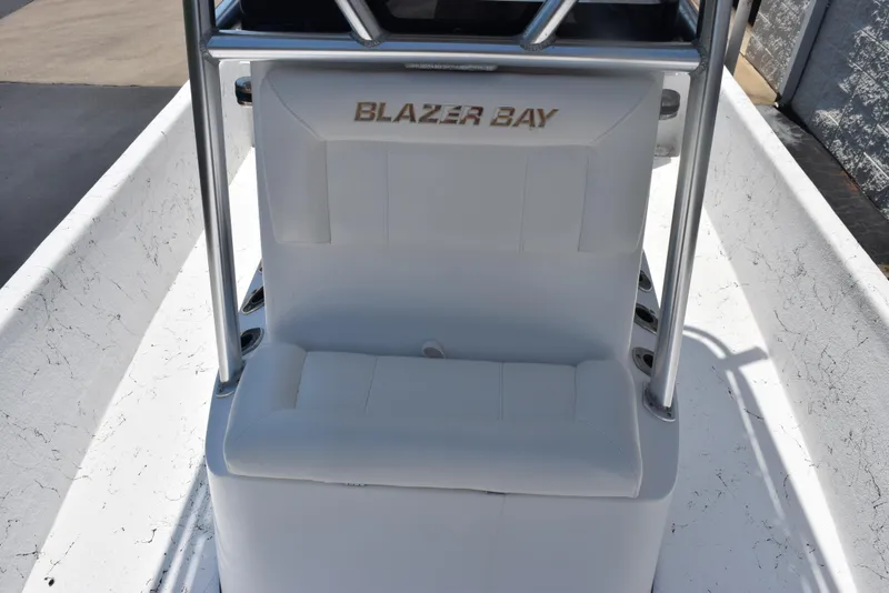 Slide: The Image of 2013 Blazer Bay 2170 boat seat with white upholstery and metal frame. - 12