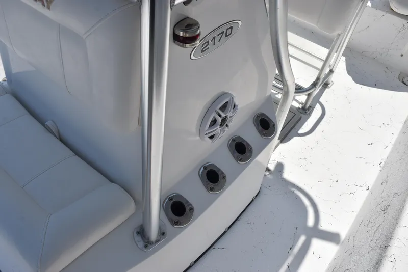 Slide: The Image of 2013 Blazer Bay 2170 boat interior with rod holders and speaker. - 13