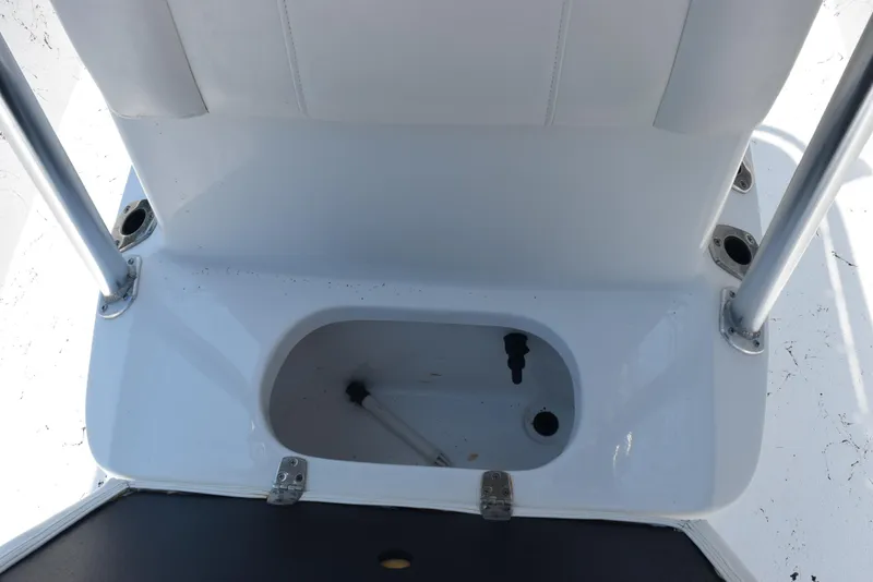 Slide: The Image of 2013 Blazer Bay 2170 boat storage compartment with rod holders and seating. - 16
