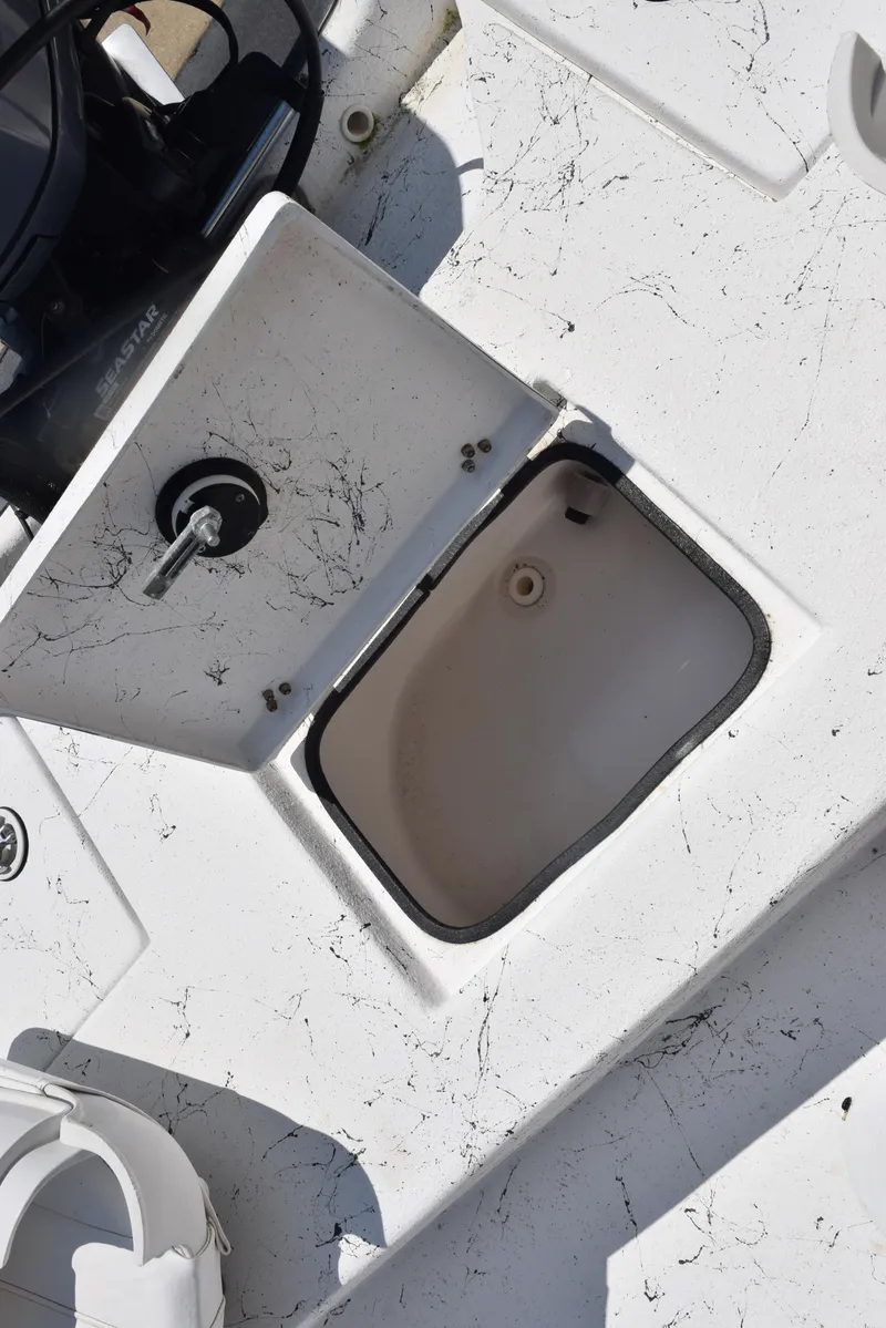 Slide: The Image of Open storage compartment on 2013 Blazer Bay 2170 boat deck. - 17
