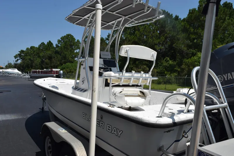 Slide: The Image of 2013 Blazer Bay 2170 boat with Yamaha engine, parked outdoors. - 6