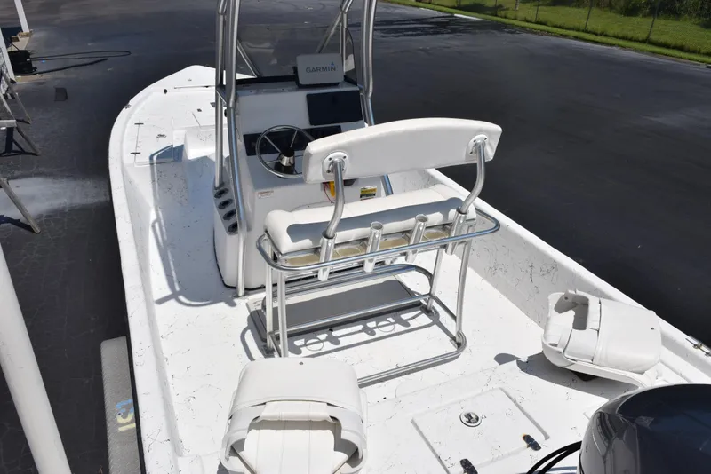 Slide: The Image of 2013 Blazer Bay 2170 boat with white seating and steering console. - 7