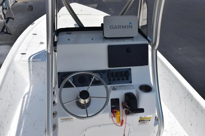 Slide: The Image of 2013 Blazer Bay 2170 boat console with Garmin navigation system and steering wheel. - 8