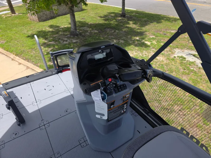 Slide: The Image of 2025 Sea-Doo Switch Compact Sport boat dashboard with steering controls and seating area. - 10