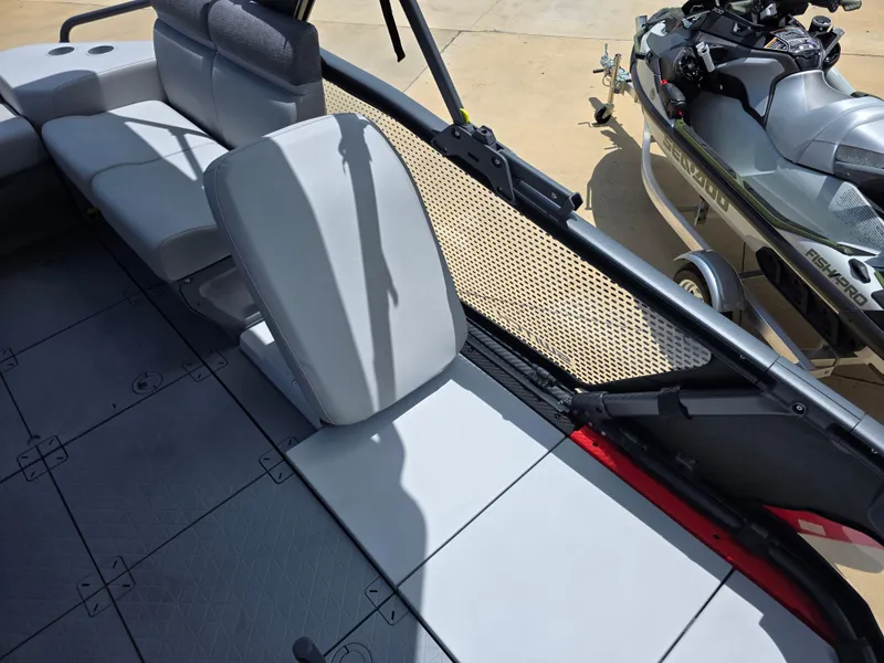Slide: The Image of 2025 Sea-Doo Switch Compact Sport boat interior with seating and deck details. - 9