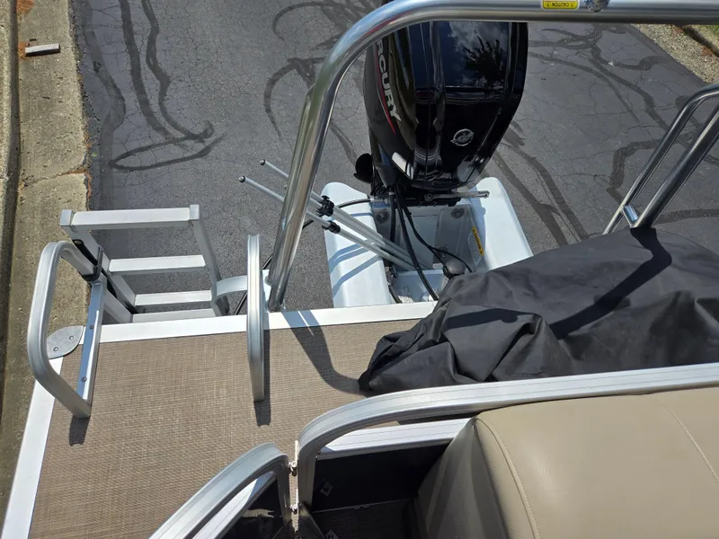 Slide: The Image of 2022 Sun Tracker Party Barge 20 DLX with Mercury outboard motor and boarding ladder. - 14