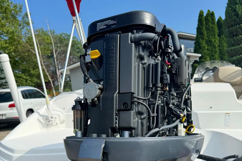 Slide: The Image of 2014 NauticStar 203SC Sport Deck boat engine close-up, showcasing Yamaha motor details. - 11