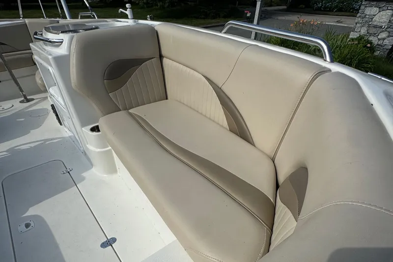 Slide: The Image of 2014 NauticStar 203SC Sport Deck boat interior with beige seating. - 13