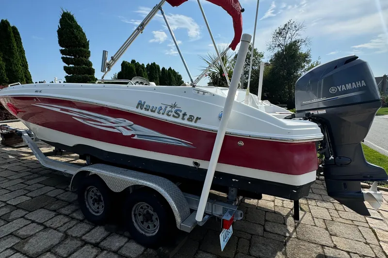 Slide: The Image of 2014 NauticStar 203SC Sport Deck boat with Yamaha engine on trailer. - 6