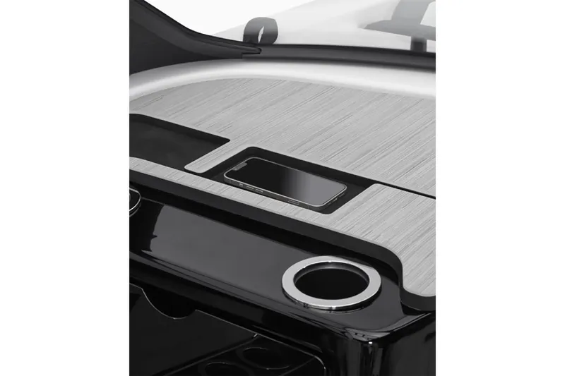 Slide: The Image of 2025 Yamaha Boats 222S dashboard with sleek design and integrated smartphone holder. - 3