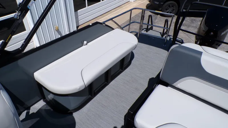 Slide: The Image of 2025 Godfrey Sweetwater 2486 SFLC boat interior with seating and storage compartments. - 11