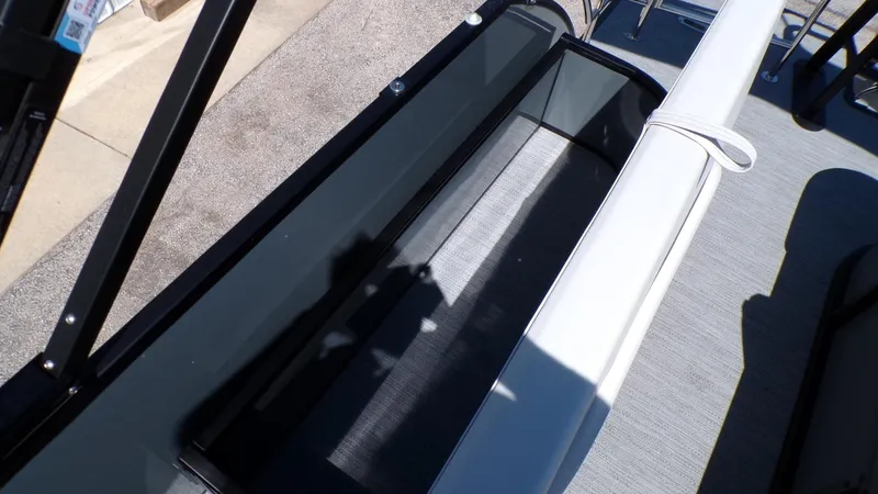 Slide: The Image of 2025 Godfrey Sweetwater 2486 SFLC boat interior with seating and storage. - 12