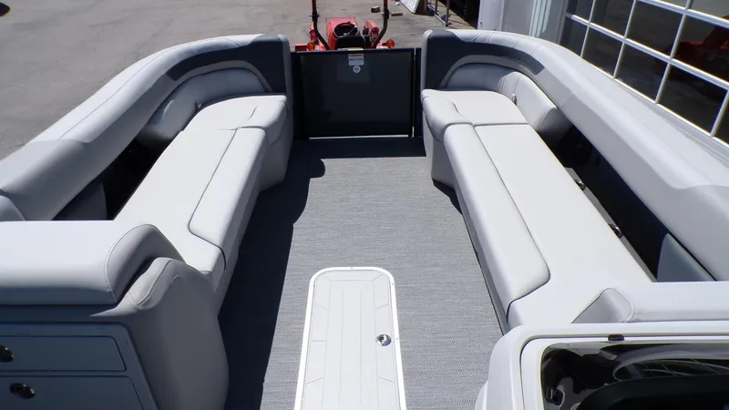 Slide: The Image of 2025 Godfrey Sweetwater 2486 SFLC pontoon boat interior with spacious seating. - 20