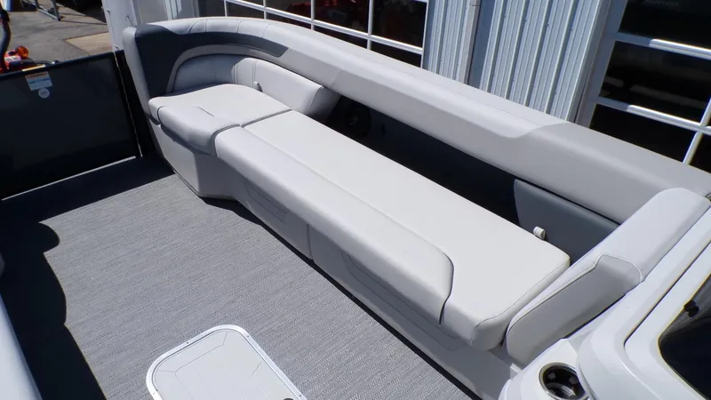 Slide: The Image of 2025 Godfrey Sweetwater 2486 SFLC boat interior with spacious seating and modern design. - 21
