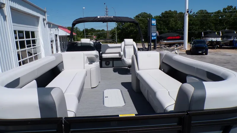 Slide: The Image of 2025 Godfrey Sweetwater 2486 SFLC pontoon boat with spacious seating and modern design. - 22