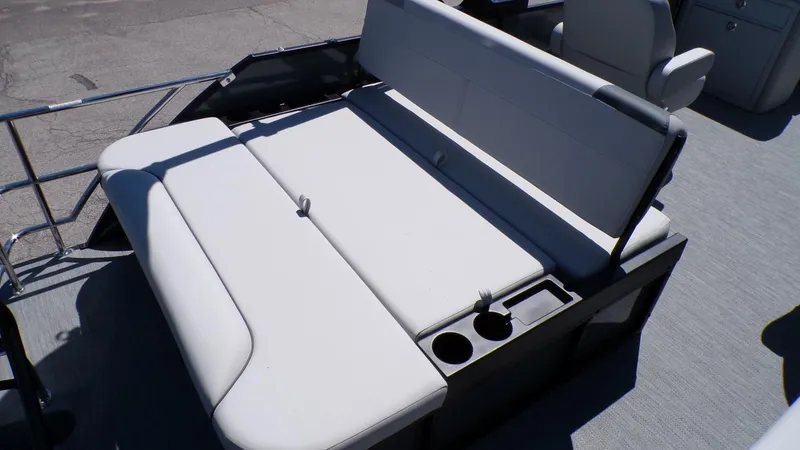 Slide: The Image of 2025 Godfrey Sweetwater 2486 SFLC boat seating with cup holders, gray upholstery. - 8