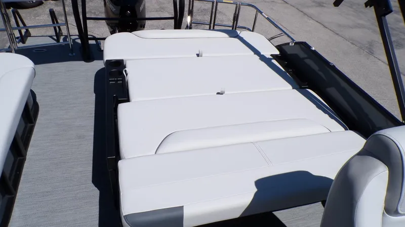 Slide: The Image of 2025 Godfrey Sweetwater 2486 SFLC boat with spacious white seating area. - 9