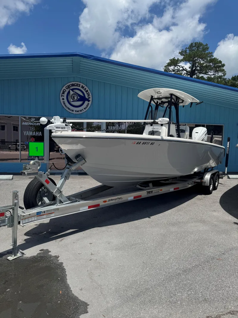 Slide: The Image of 2023 Pathfinder 2700 Open boat on trailer outside marine dealership. - 3
