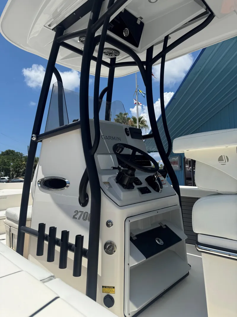 Slide: The Image of 2023 Pathfinder 2700 Open boat console with Garmin electronics and rod holders. - 5