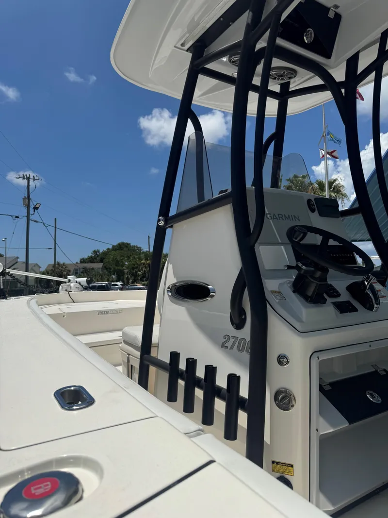 Slide: The Image of 2023 Pathfinder 2700 Open boat interior with steering console and equipment. - 6