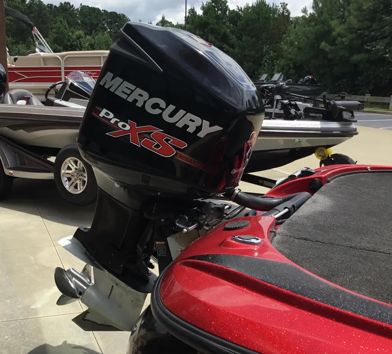Slide: The Image of 2013 Nitro Z8 boat with Mercury Pro XS outboard motor in a parking area. - 12