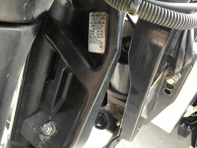 Slide: The Image of Close-up of a 2013 Nitro Z8 boat engine component with visible serial number label. - 14