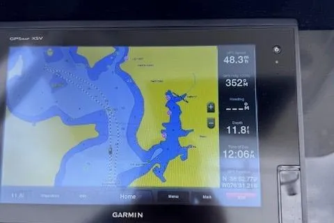 Slide: The Image of Garmin GPS display on 2017 Edgewater 262CC showing navigation map and data. - 15