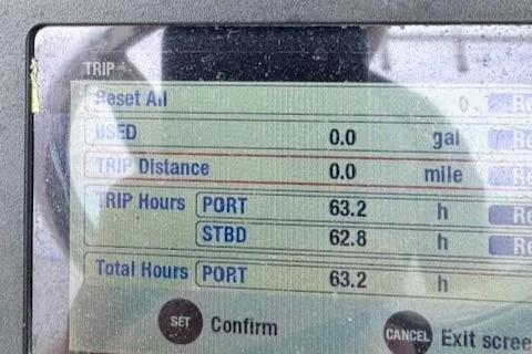 Slide: The Image of Display screen showing trip data for 2017 Edgewater 262CC boat, including hours and distance. - 17