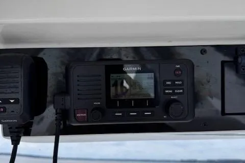 Slide: The Image of Garmin marine radio on 2017 Edgewater 262CC boat dashboard. - 18
