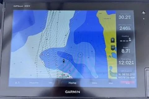 Slide: The Image of Garmin GPS display on 2017 Edgewater 262CC showing nautical map and navigation data. - 19
