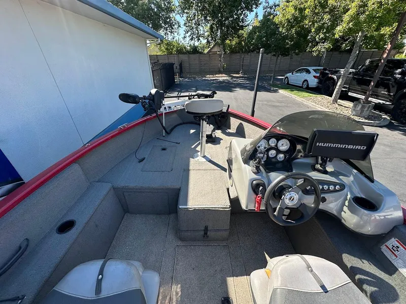 Slide: The Image of 2013 Tracker Pro Guide V-175 SC boat interior with steering console and Humminbird electronics. - 12