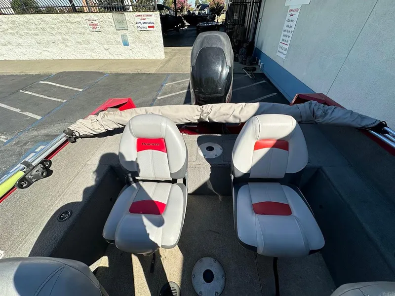 Slide: The Image of 2013 Tracker Pro Guide V-175 SC boat interior with two seats and motor. - 15
