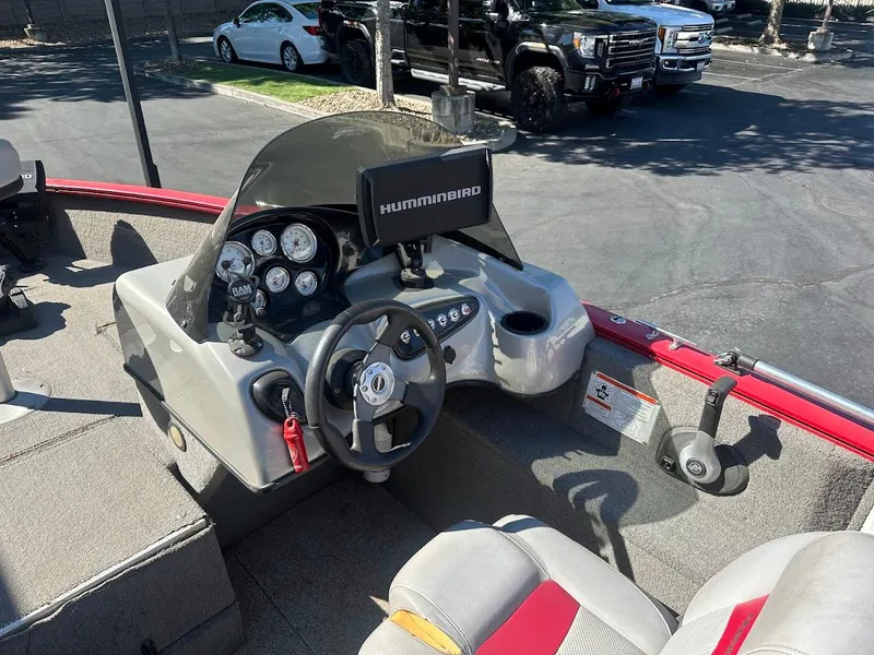 Slide: The Image of 2013 Tracker Pro Guide V-175 SC boat dashboard with steering wheel and Humminbird display. - 17